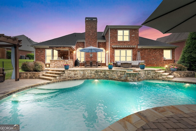 1610 Turtle Pond Dr, Hoschton, GA 30548 - pool at dusk featuring outdoor lounge area, a patio, and outdoor dining area