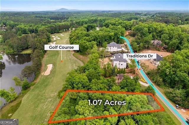 241 Traditions Dr, Alpharetta, GA 30004 - aerial view of property's location with a large body of water, a forest, property parcel outlined, and a golf course