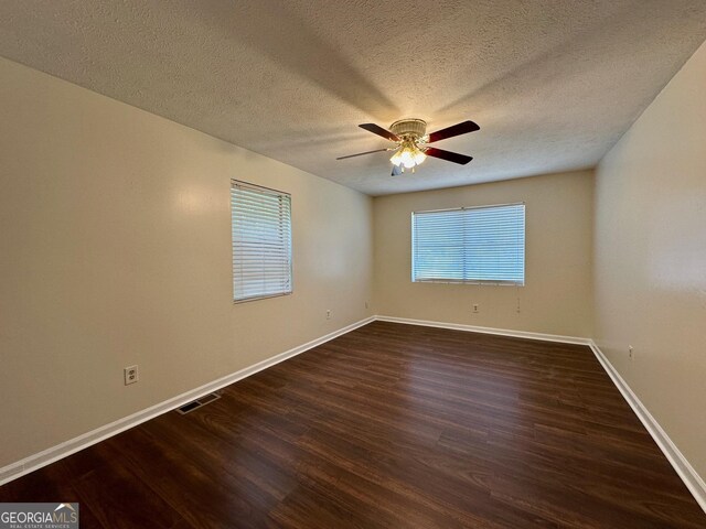 485 Angham Rd, Hiram, GA 30141 - unfurnished living room featuring dark wood-style flooring and ceiling fan