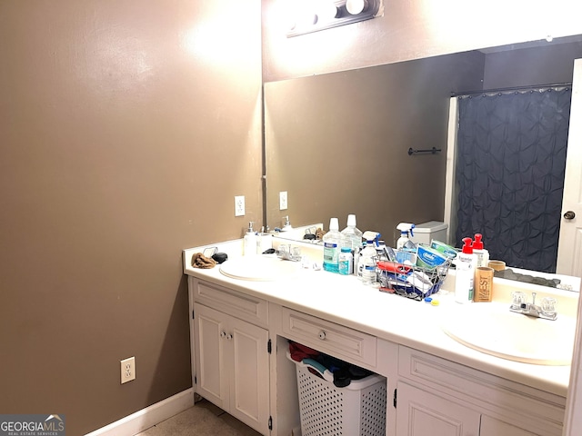 1511 Woodland Dr, Bainbridge, GA 39817 - bathroom with double vanity and toilet