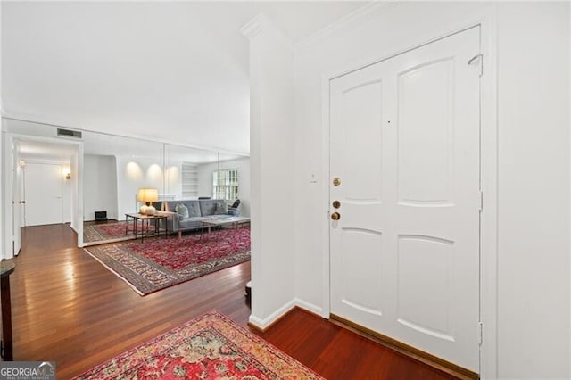 52 Chaumont Sq NW, Atlanta, GA 30327 - entryway with wood finished floors, crown molding, and baseboards
