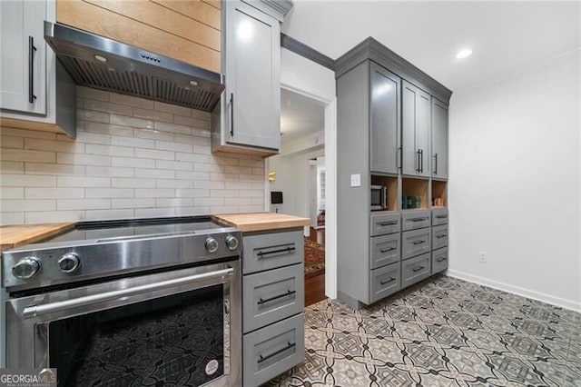 52 Chaumont Sq NW, Atlanta, GA 30327 - kitchen featuring wooden counters, appliances with stainless steel finishes, ventilation hood, gray cabinetry, and tasteful backsplash