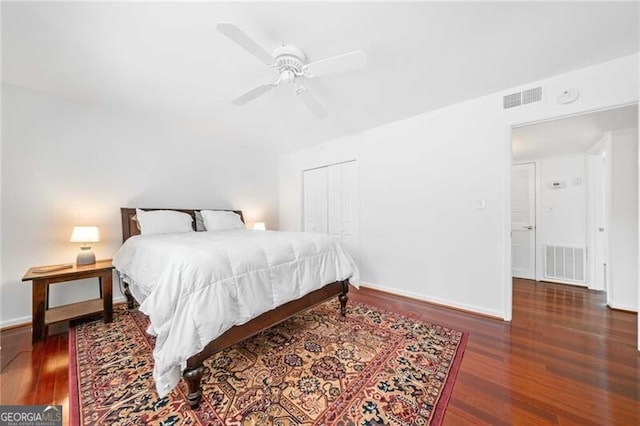 52 Chaumont Sq NW, Atlanta, GA 30327 - bedroom with wood finished floors, baseboards, a ceiling fan, and a closet