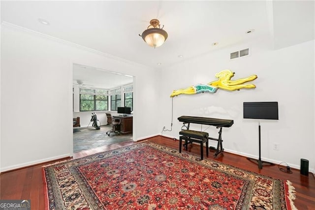 52 Chaumont Sq NW, Atlanta, GA 30327 - sitting room with wood finished floors, a desk, baseboards, and crown molding