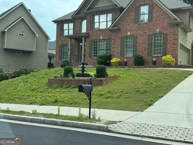 1932 River Crest Way, Lawrenceville, GA 30045 - view of front of house with a front yard and brick siding
