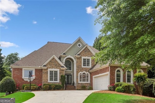 1029 Ector Dr NW, Kennesaw, GA 30152 - view of front of house with driveway, stone siding, a front lawn, a garage, and roof with shingles