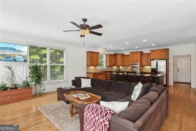 1029 Ector Dr NW, Kennesaw, GA 30152 - living room with crown molding, a ceiling fan, light wood-type flooring, and recessed lighting