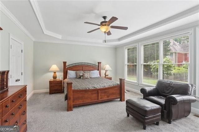 1029 Ector Dr NW, Kennesaw, GA 30152 - bedroom featuring a tray ceiling, light carpet, ornamental molding, baseboards, and a ceiling fan