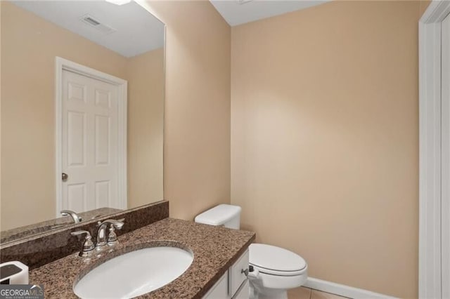 1029 Ector Dr NW, Kennesaw, GA 30152 - bathroom featuring vanity, toilet, and tile patterned floors
