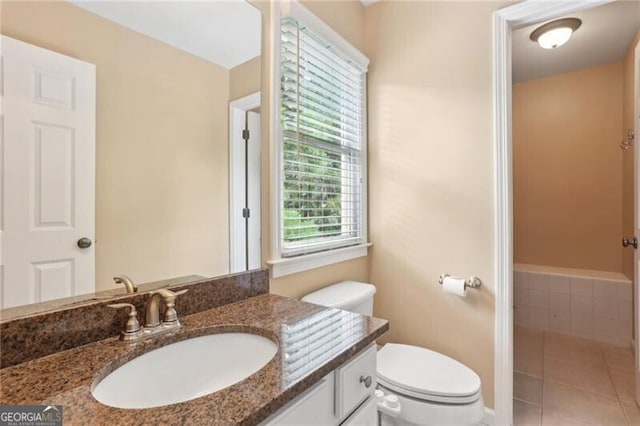 1029 Ector Dr NW, Kennesaw, GA 30152 - bathroom featuring toilet, vanity, and tile patterned flooring