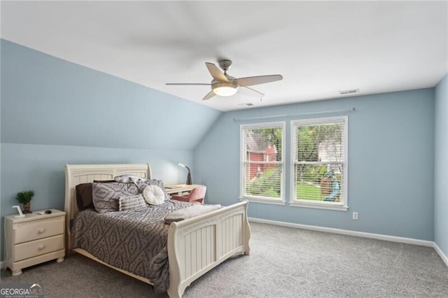 1029 Ector Dr NW, Kennesaw, GA 30152 - carpeted bedroom with vaulted ceiling, baseboards, and a ceiling fan