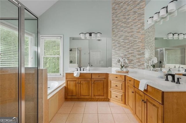 6610 Major Dr, Cumming, GA 30040 - bathroom featuring high vaulted ceiling, tile patterned flooring, a shower stall, a bath, and vanity