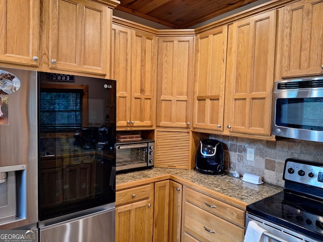 kitchen featuring stainless steel appliances, backsplash, wooden ceiling, and tile countertops