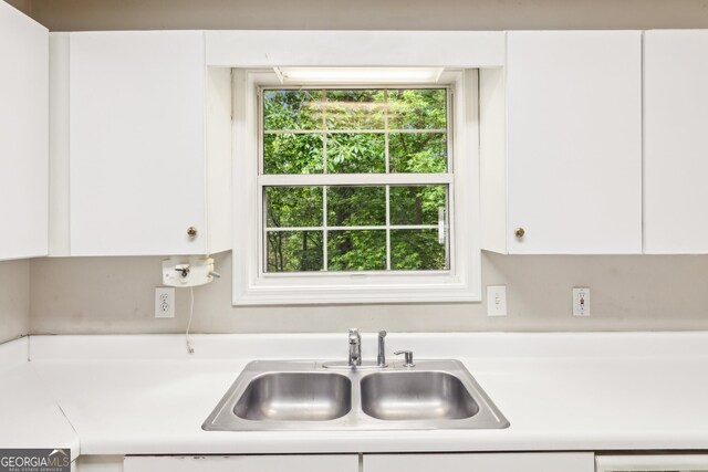 111 Trellis Ct, Acworth, GA 30101 - kitchen with a sink, light countertops, and white cabinets