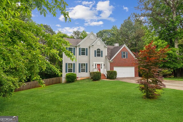 111 Trellis Ct, Acworth, GA 30101 - view of front of house featuring concrete driveway, an attached garage, a chimney, and brick siding