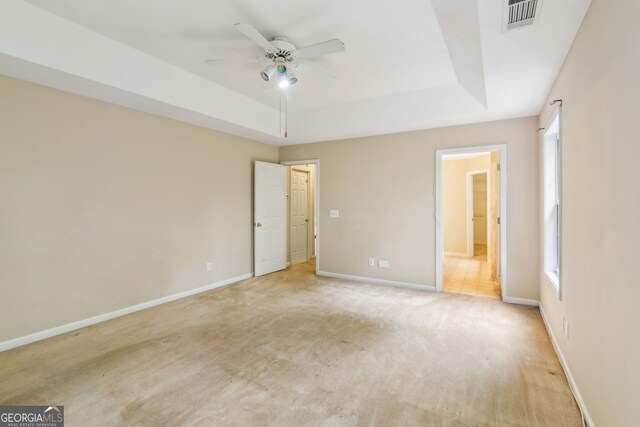 111 Trellis Ct, Acworth, GA 30101 - unfurnished bedroom featuring a raised ceiling, baseboards, and light carpet