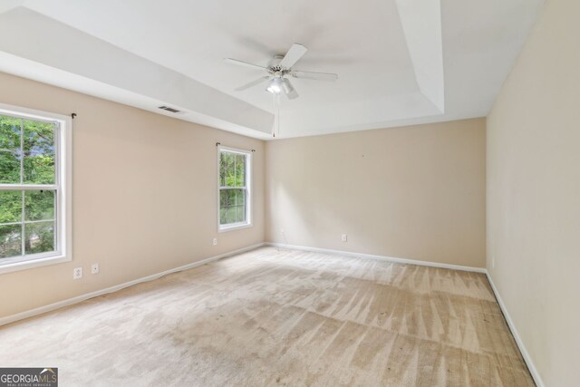 111 Trellis Ct, Acworth, GA 30101 - carpeted spare room featuring a raised ceiling, a ceiling fan, and baseboards