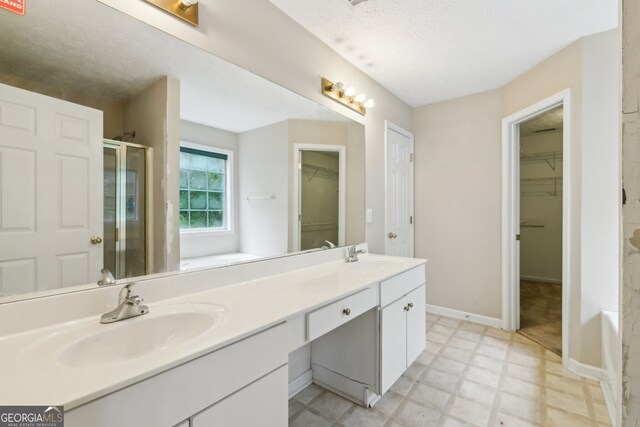 111 Trellis Ct, Acworth, GA 30101 - bathroom with tile patterned floors, a stall shower, double vanity, a walk in closet, and a tub