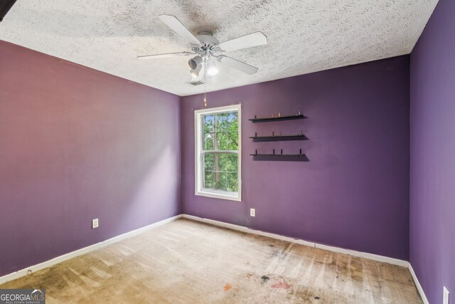 111 Trellis Ct, Acworth, GA 30101 - spare room featuring a ceiling fan, baseboards, and a textured ceiling