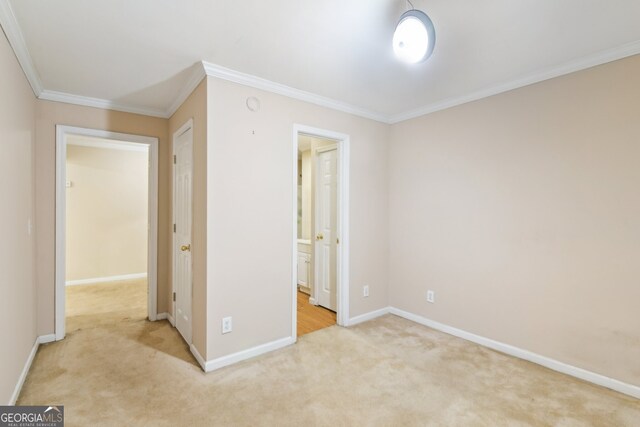 111 Trellis Ct, Acworth, GA 30101 - unfurnished bedroom featuring carpet floors, crown molding, baseboards, and ensuite bath