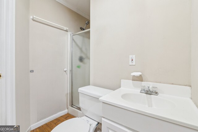 111 Trellis Ct, Acworth, GA 30101 - bathroom with toilet, a shower with door, vanity, wood finished floors, and baseboards