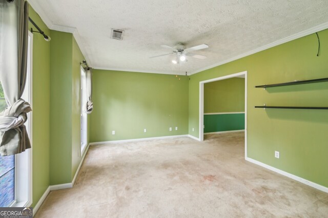 111 Trellis Ct, Acworth, GA 30101 - unfurnished room featuring ornamental molding, ceiling fan, a textured ceiling, light colored carpet, and baseboards