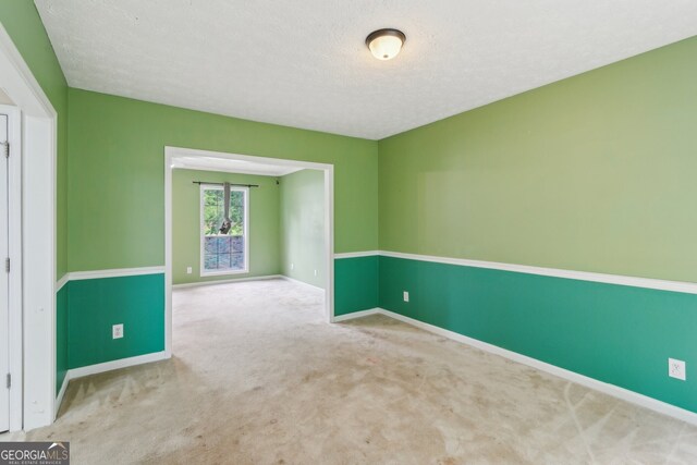111 Trellis Ct, Acworth, GA 30101 - unfurnished room featuring baseboards, carpet, and a textured ceiling