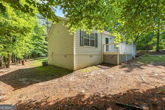 1154 Pinebrook Rd, Auburn, GA 30011 - view of property exterior featuring crawl space, a deck, and central AC unit