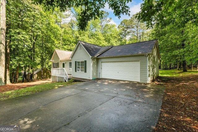 1154 Pinebrook Rd, Auburn, GA 30011 - ranch-style home with driveway, an attached garage, and a shingled roof