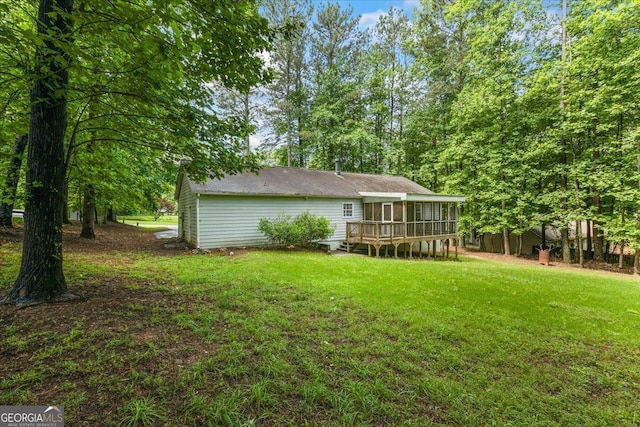 1154 Pinebrook Rd, Auburn, GA 30011 - rear view of house with a sunroom, a lawn, and a deck