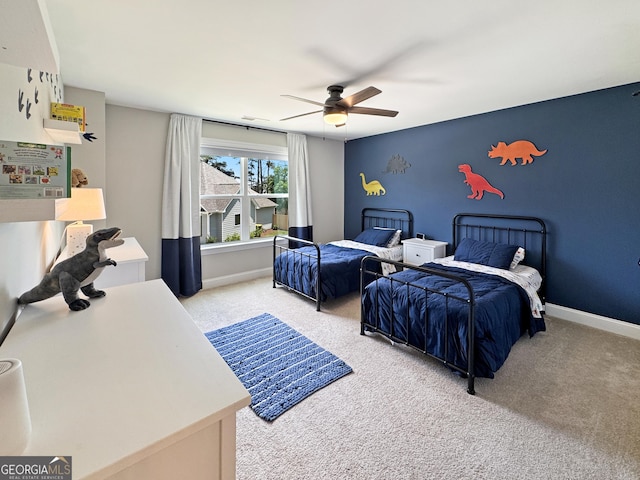 35 Perkins Cv, Senoia, GA 30276 - carpeted bedroom featuring ceiling fan and baseboards