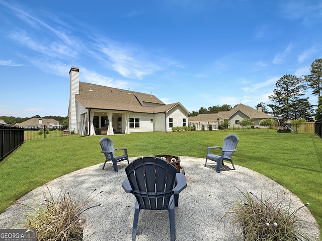 35 Perkins Cv, Senoia, GA 30276 - view of patio with a playground and a fire pit