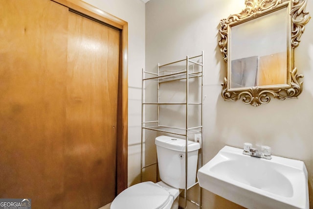 1176 Cardinal Rd NE, Conyers, GA 30012 - bathroom with a sink and toilet