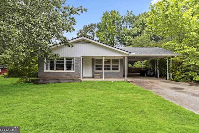 1176 Cardinal Rd NE, Conyers, GA 30012 - view of front facade with a front yard, concrete driveway, and a carport