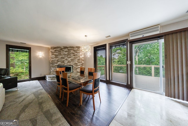 dining space with a chandelier and wood finished floors