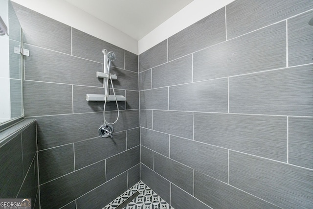 full bathroom with a tile shower