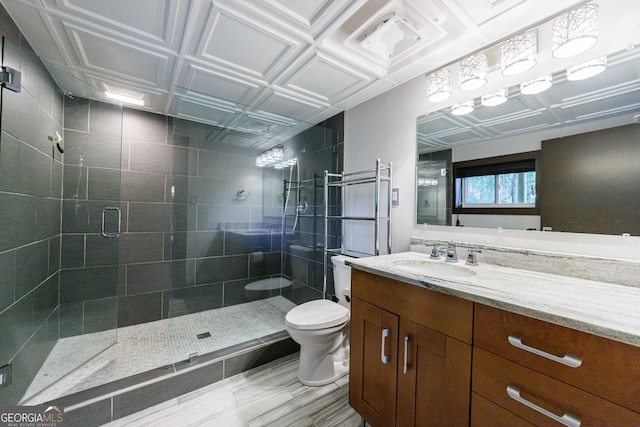 full bath with toilet, a stall shower, and vanity