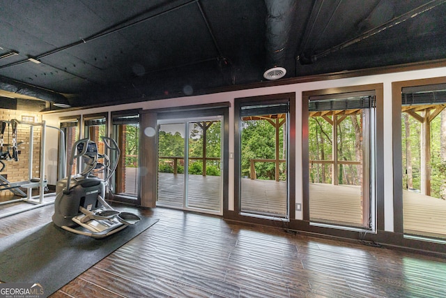 gym featuring wood finished floors