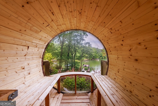 sauna with wooden walls and wood ceiling