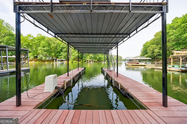 dock area with a water view
