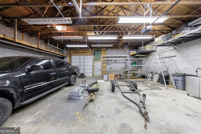garage with concrete block wall
