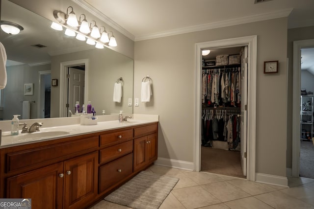 1231 Founders Lake Dr, Athens, GA 30606 - full bath with tile patterned flooring, ornamental molding, double vanity, a spacious closet, and baseboards