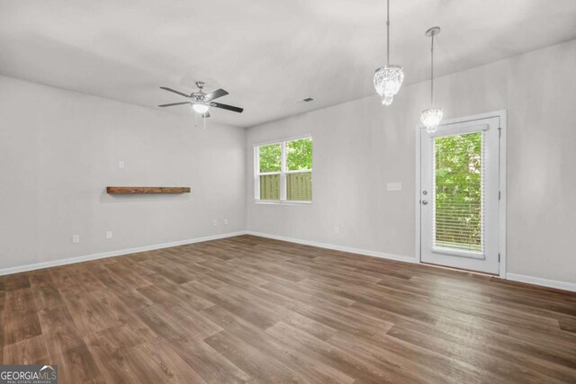 3181 Meadowstone Ln SW, Atlanta, GA 30331 - unfurnished living room with wood finished floors, a ceiling fan, and baseboards