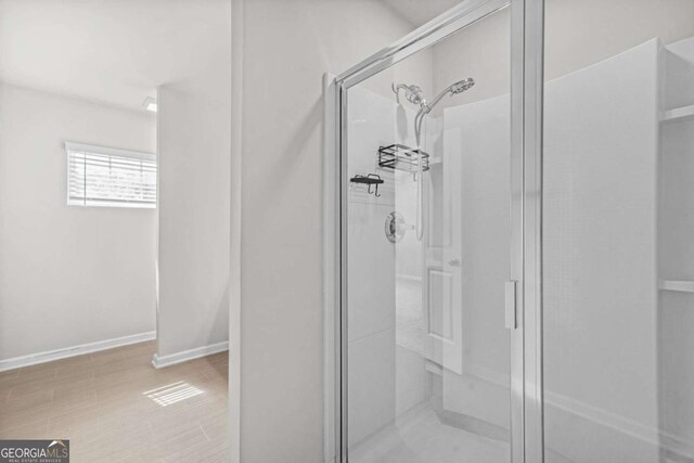 3181 Meadowstone Ln SW, Atlanta, GA 30331 - full bathroom featuring a stall shower and baseboards