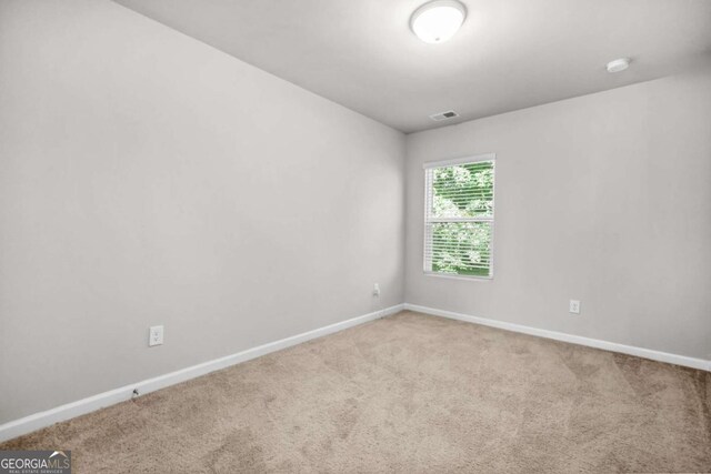 3181 Meadowstone Ln SW, Atlanta, GA 30331 - carpeted empty room with baseboards