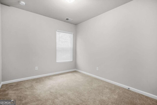 3181 Meadowstone Ln SW, Atlanta, GA 30331 - spare room with carpet, baseboards, and a smoke detector