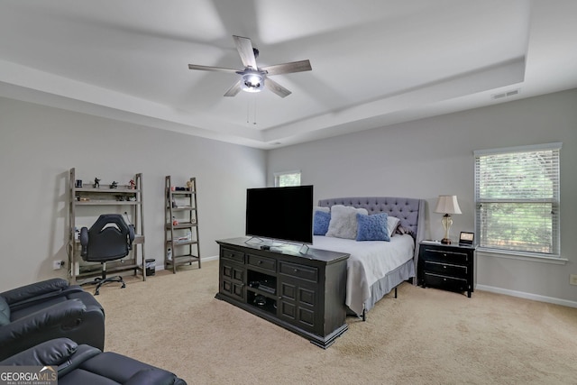 4251 Haywater Cv, Buford, GA 30519 - carpeted bedroom with a raised ceiling, multiple windows, baseboards, and a ceiling fan