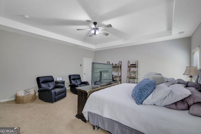 4251 Haywater Cv, Buford, GA 30519 - bedroom featuring a raised ceiling, carpet, a ceiling fan, and baseboards