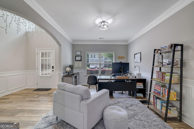 4251 Haywater Cv, Buford, GA 30519 - home office featuring wood finished floors, ornamental molding, arched walkways, wainscoting, and a decorative wall