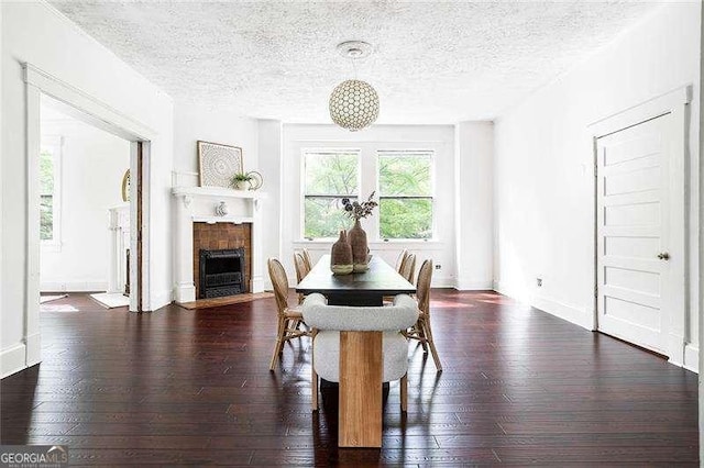 118 Waverly Way, Atlanta, GA 30307 - dining space with a textured ceiling, a fireplace with flush hearth, hardwood / wood-style floors, and baseboards